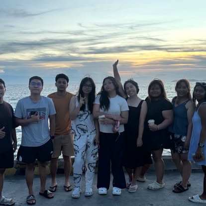 Alpas Diving community together by the sea at sunset
